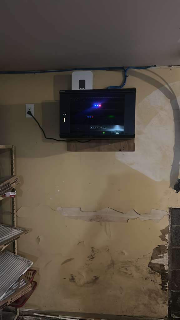Wall-mounted NVR in a locked enclosure