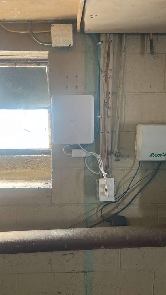 Wall-mounted wireless access point in a maintenance room
